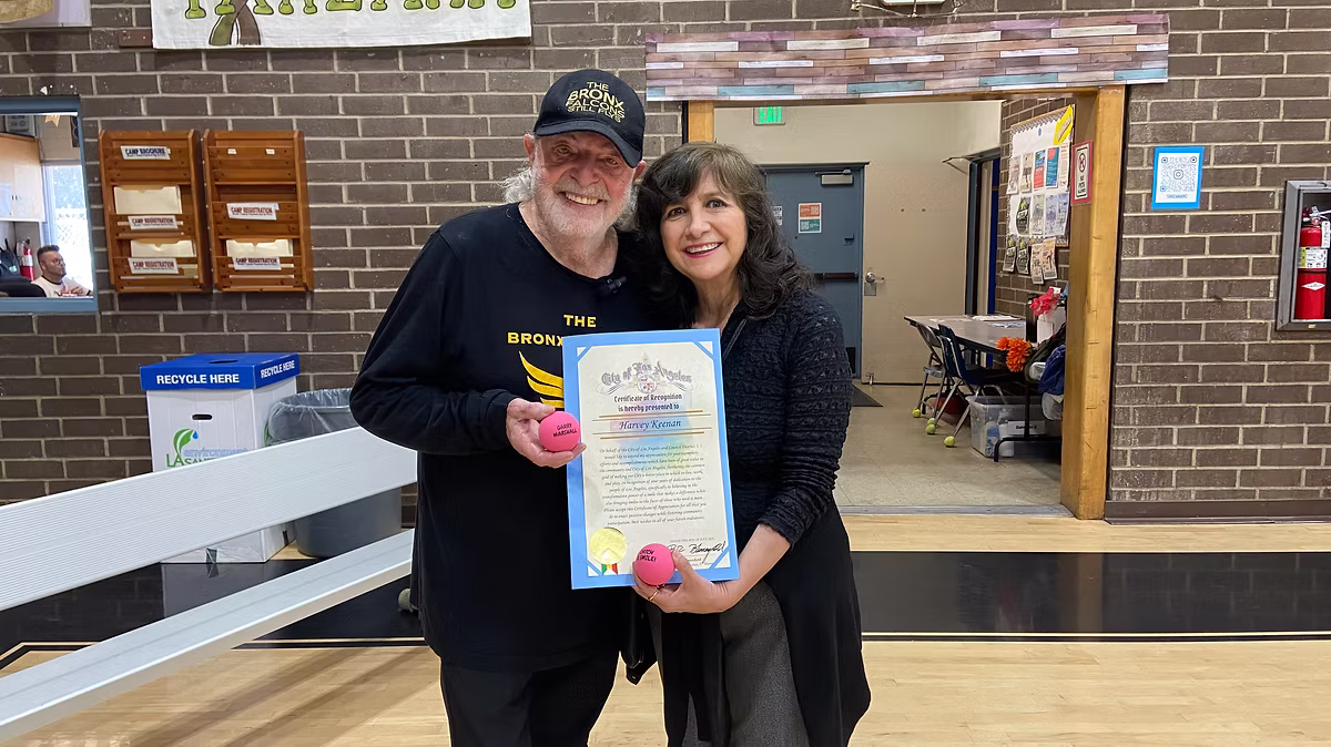 Harvey receiving Certificate of Recognition with Alice Roth